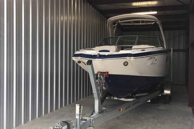 Boat stored inside an enclosed storage unit
